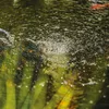 Close-up of water surface with reflections and bubbles, possibly from a pond or fountain. Produktbild-Vorschau