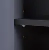 A close-up view of the interior of a dark gray cabinet, showing a shelf and two small holes in the side panel. Podgląd zdjęcia produktu