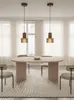 A dining room setting with a table and chairs. Anteprima dell’immagine prodotto