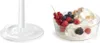 A split image showing the base of a kitchen appliance on the left and a bowl of whipped cream with berries on the right. Voir les images du produit
