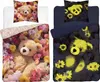 Two different designs of teddy bear bedding sets with floral patterns, one in bright colors and the other in a darker, glow-in-the-dark style. Produktbild-Vorschau