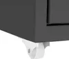 A close-up view of the bottom corner of a dark gray cabinet, showing a white caster wheel attached to its base. Náhled obrázku produktu