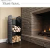 A metal firewood rack filled with logs next to a stone fireplace. Náhled obrázku produktu