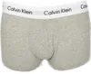 A close-up view of grey Calvin Klein boxer shorts with the brand name visible on the white waistband. Voir les images du produit
