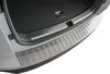 A close-up view of the rear bumper and trunk area of a car, featuring a stainless steel protective plate. Produktbild-Vorschau