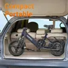 A blue foldable electric bicycle is placed inside the trunk of a car. Produktbild-Vorschau