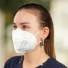 A woman wearing a face mask and a necklace. Produktbild-Vorschau