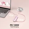 A pink USB-C hub is connected to a laptop and a power adapter, illustrating fast charging capabilities. Produktbild-Vorschau