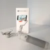 A DJI Osmo Mobile 7 smartphone gimbal and its packaging are displayed on a white surface. Voir les images du produit