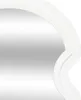 A close-up view of the edge of a white mirror with a decorative frame. Náhľad obrázku produktu
