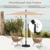 An outdoor patio scene with a beige umbrella, two chairs, and a view of the ocean in the background. Podgląd zdjęcia produktu