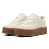 A pair of beige Puma Karmen II Idol SD shoes with brown soles, shown from a slightly angled front view on a white background. Produktbild-Vorschau