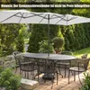 An outdoor patio scene with a table and chairs set up under a large rectangular umbrella. Náhled obrázku produktu
