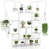 A white metal plant stand with multiple shelves and hanging hooks, filled with various potted plants. Produktbild-Vorschau