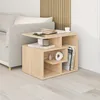 A modern wooden side table next to a sofa, with books and decorative items on it. Produktbild-Vorschau