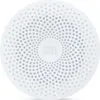 A white, circular speaker with a patterned surface and a central logo. Podgląd zdjęcia produktu