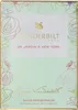 The image shows the front of a perfume box with floral designs. Voir les images du produit