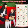 A mother and daughter are sitting on a red couch, smiling and holding Christmas gifts. Behind them, a fabric advent calendar with 24 pockets is hanging. Produktbild-Vorschau