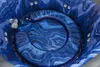 Top-down view of the interior of a blue, marbled hot tub. Produktbild-Vorschau