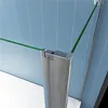 Close-up view of a shower enclosure corner with a silver frame and green glass panels. Produktbild-Vorschau