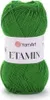 A ball of green yarn with a white label. Podgląd zdjęcia produktu