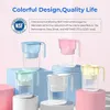 Several colored water filter pitchers are displayed on a pastel background. Podgląd zdjęcia produktu