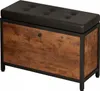 A storage bench with a tufted black seat and a wood-grain front panel with a black metal frame. Podgląd zdjęcia produktu