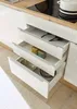 A close-up view of kitchen drawers, showcasing kitchenware and pantry items. Produktbild-Vorschau