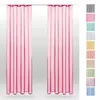 Two pink curtains hanging from a rod, with a strip of other colored curtains on the right side. Produktbild-Vorschau