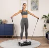 A woman is exercising on a vibration plate in a room. Produktbild-Vorschau