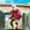 A statue of Jiraiya from Naruto Shippuden in a dynamic pose, standing in front of a traditional Japanese-style gate. Podgląd zdjęcia produktu