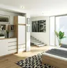 A modern bedroom with a wardrobe, stairs, and a large window. Anteprima dell’immagine prodotto