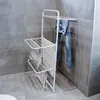 A white drying rack with clothes on it in a bathroom. Produktbild-Vorschau