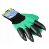A pair of green gardening gloves with black claws on the fingertips, presented on a white background. Anteprima dell’immagine prodotto