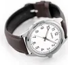 A close-up, angled shot of a Casio watch with a white face and a brown leather strap, set against a white background. Produktbild-Vorschau