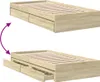 A wooden bed frame with drawers shown in two states: closed and open. Produktbild-Vorschau
