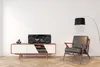 A retro boombox sits on a modern media console next to a stylish armchair and a floor lamp. Produktbild-Vorschau