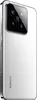 A close-up, angled view of the back of a white Xiaomi smartphone, showcasing its camera module and branding. Podgląd zdjęcia produktu