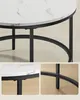 Collage showing details of a round coffee table with a marble-look top and black metal legs. Náhled obrázku produktu