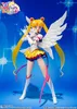 A Sailor Moon action figure with wings, posed against a blue, starry background. Produktbild-Vorschau
