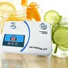 An ozone generator placed in front of drinks with fruit slices. Náhled obrázku produktu