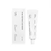 A product shot of an eye serum tube and its packaging. Podgląd zdjęcia produktu
