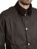 Close-up of a person wearing a green waxed jacket. Produktbild-Vorschau