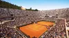 A wide shot of a packed tennis stadium during a match. Produktbild-Vorschau