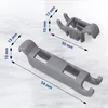 Two gray plastic dishwasher basket clips are shown on a marble-like surface with dimensions indicated by dashed lines and text. Produktbild-Vorschau