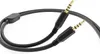 A close-up shot of a black audio cable with gold-plated connectors against a white background. Náhled obrázku produktu