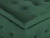 A close-up view of a green velvet ottoman. Produktbild-Vorschau
