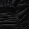 A close-up view of black fabric with elastic gathering, likely a fitted sheet. Produktbild-Vorschau