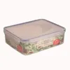 A clear plastic food storage container with a transparent lid, filled with a salad. Produktbild-Vorschau