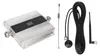 A cell phone signal extender amplifier and its accessories are laid out on a light gray background. Náhled obrázku produktu